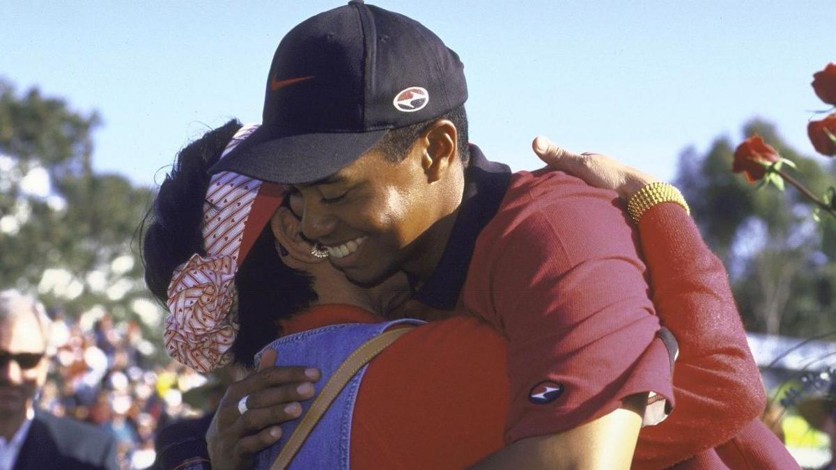 Tiger Woods hugs his mother Kultida after winning the Buick Invitational tournament in 1999