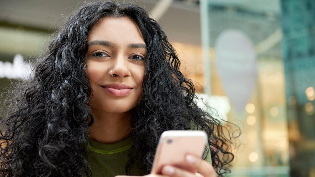 Young woman holding a phone