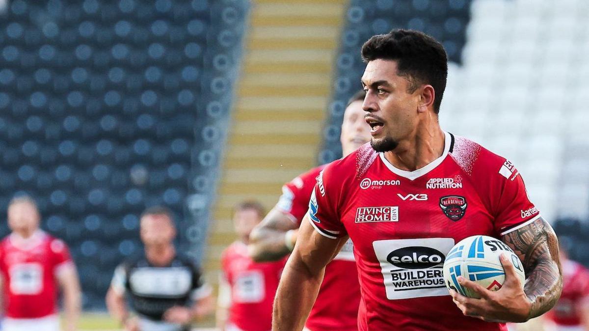 Tim Lafai races away for a Salford try against Hull FC