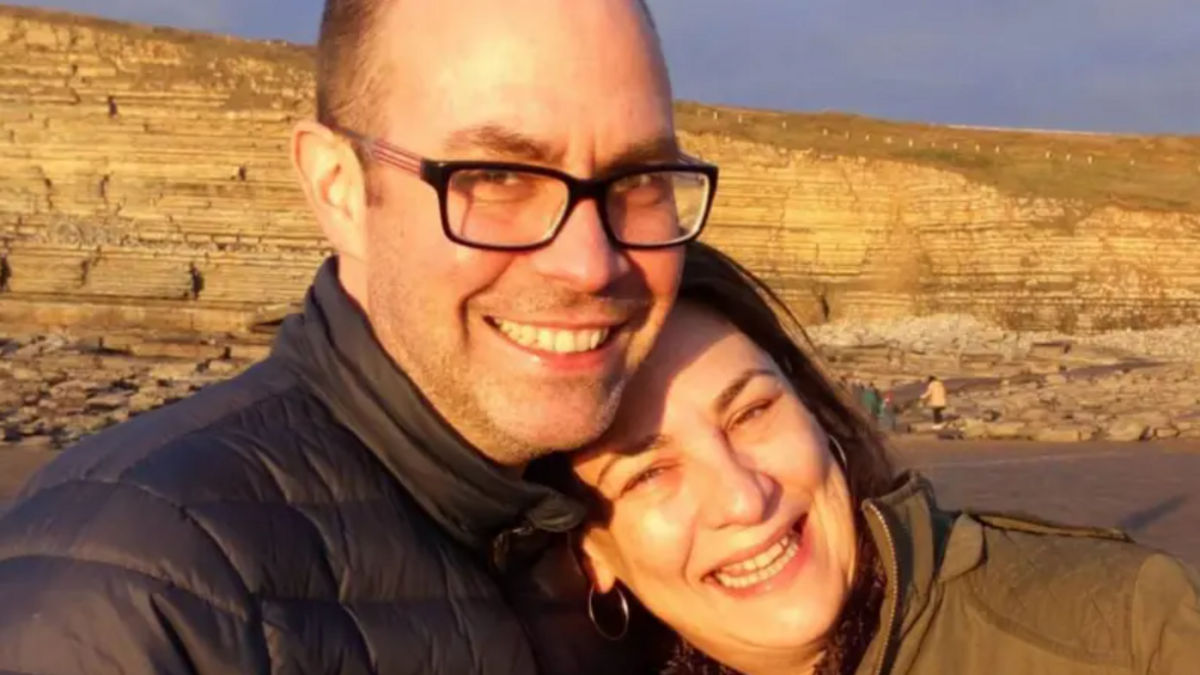 Steve Brisley smiles while embracing his sister Lianne