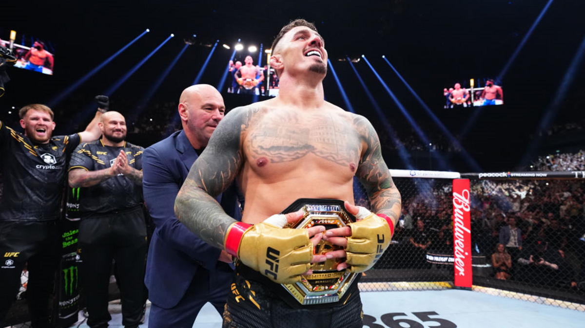 Tom Aspinall celebrates beating Curtis Blaydes successful July 2024