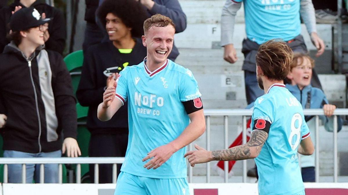 Walsall's Ryan Finnigan celebrates his goal with a team-mate