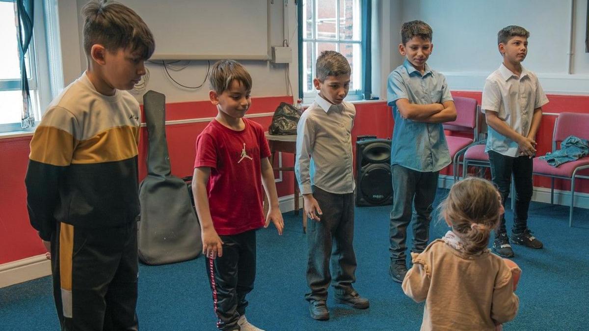 Children practicing their moves for a Bradford dance performance celebrating Gypsy culture