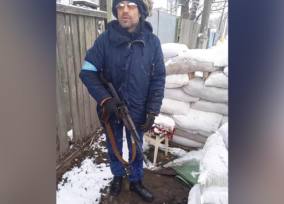 Ivan Skyba on Yablunska Street holding a rifle