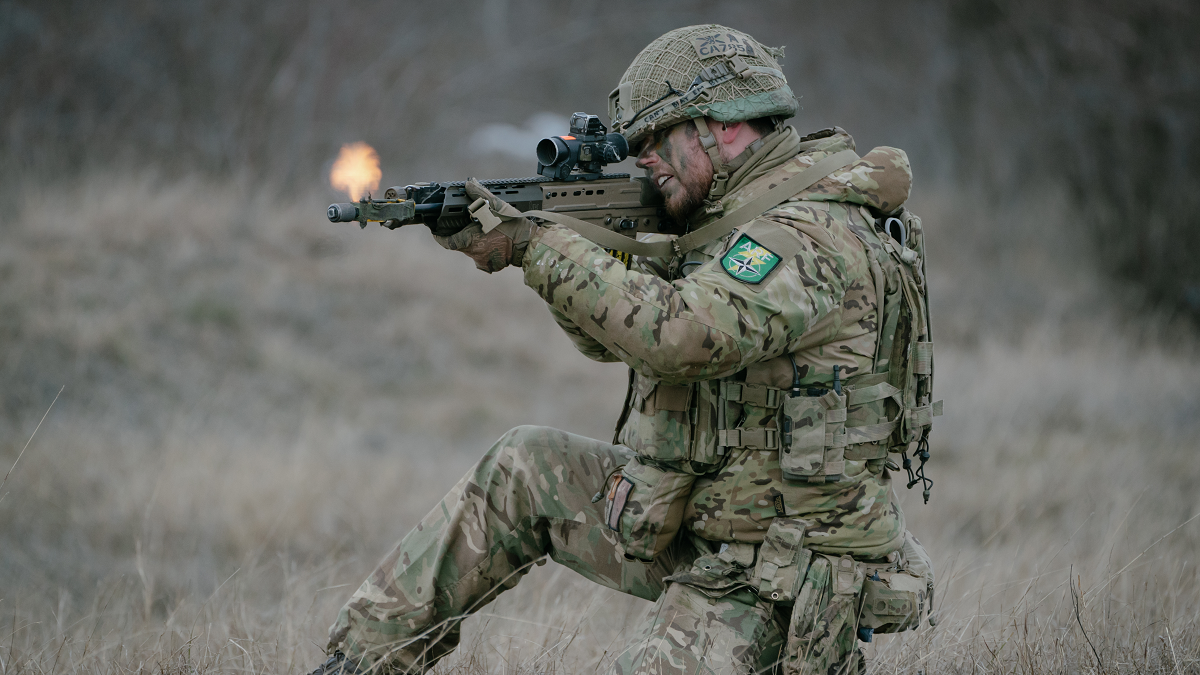 British soldiers practice retreat under fire during an exercise on February 17, 2025 in Smardan, Romania. The UK's 1st Division is commanding land forces during Exercise Steadfast Dart, as Nato Allied Reaction Force (ARF) training continues in Romania