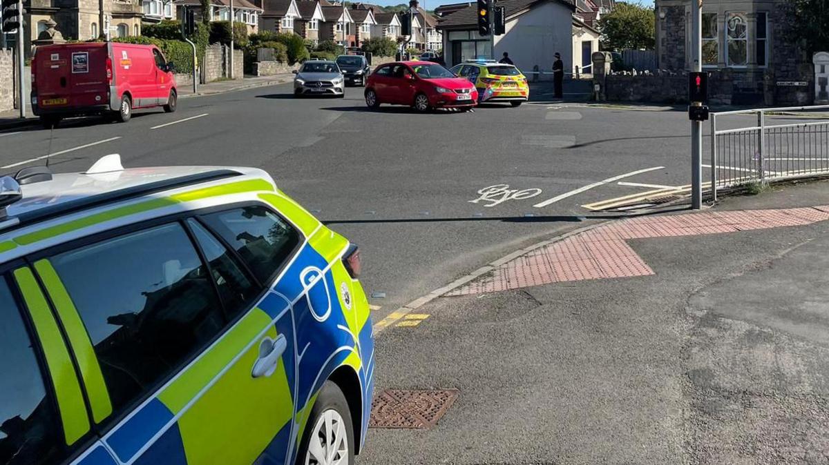 Police cars parked on a corner near Ashcombe Road in Weston-super-Mare