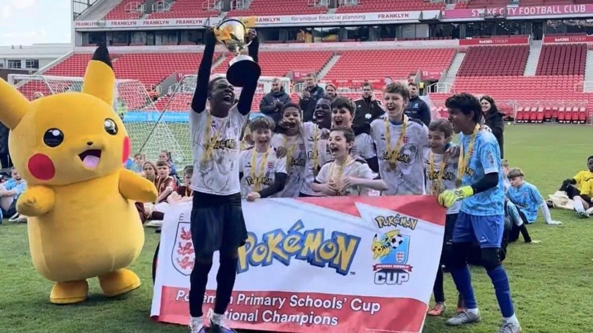 St John's CE Primary School lifting the U11 Small Schools Cup.