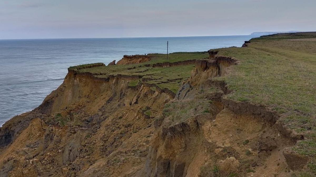 Another angle which looks much more like a landslip on the cliff edge.