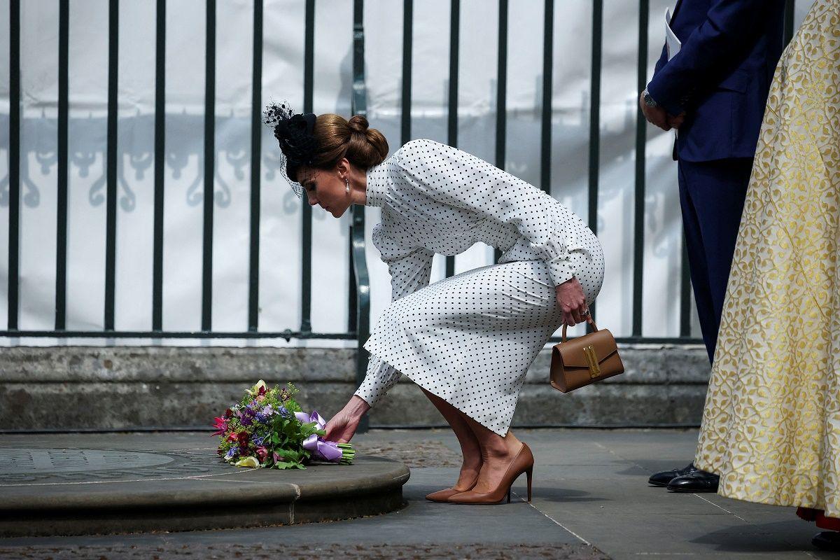 The Princess of Wales laying a bouquet of flowers.