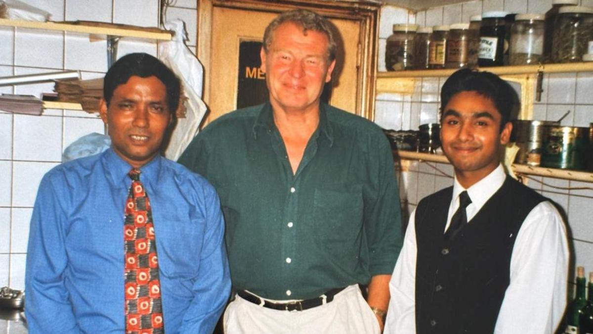 Luthfur Rahman with his father and the late Lord Paddy Ashdown in his restaurant kitchen