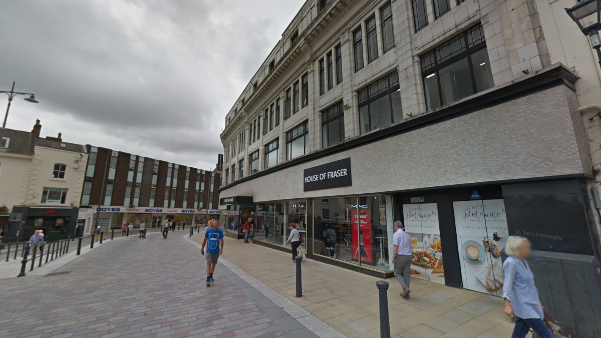 Binns House of Fraser on High Row in Darlington in the background, with shoppers in the foreground.