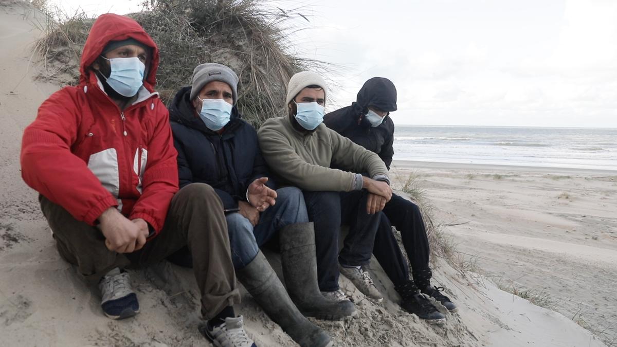 Ebrahim Mohammadpour (second from left) with other survivors from the boat, Loon Plage, France