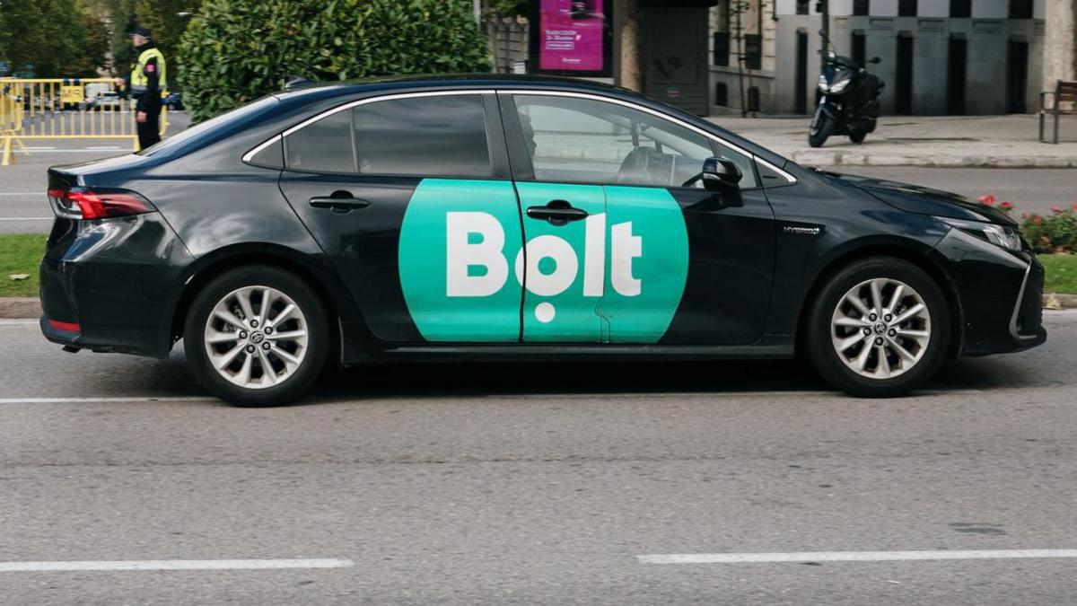 A black car with a green Bolt logo