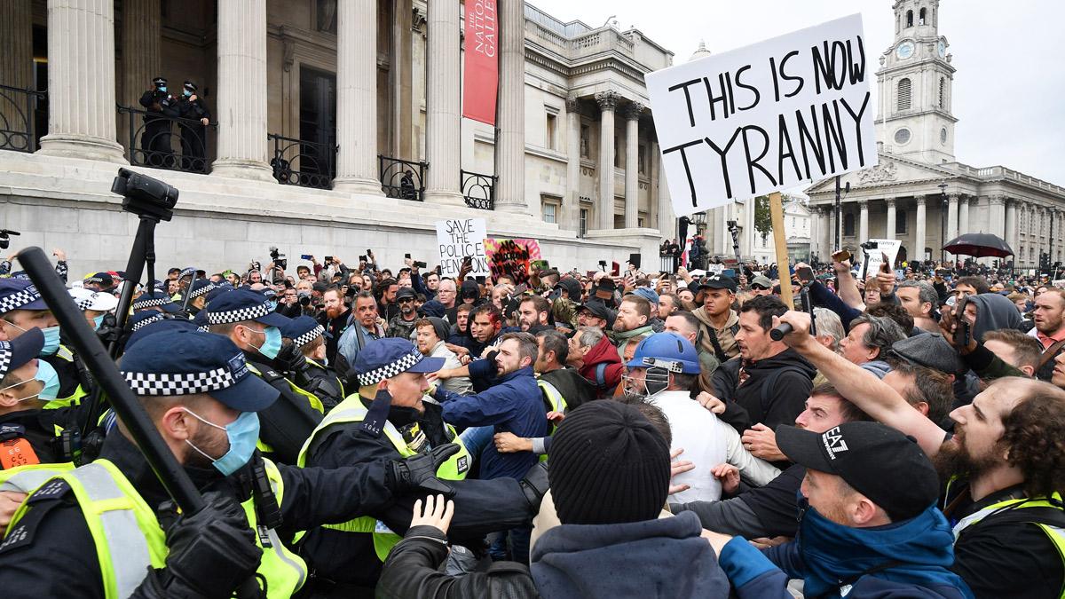 Police and protesters at a mass rally against vaccination and government Covid-19 restrictions - Trafalgar Square, London, 26 September 2020