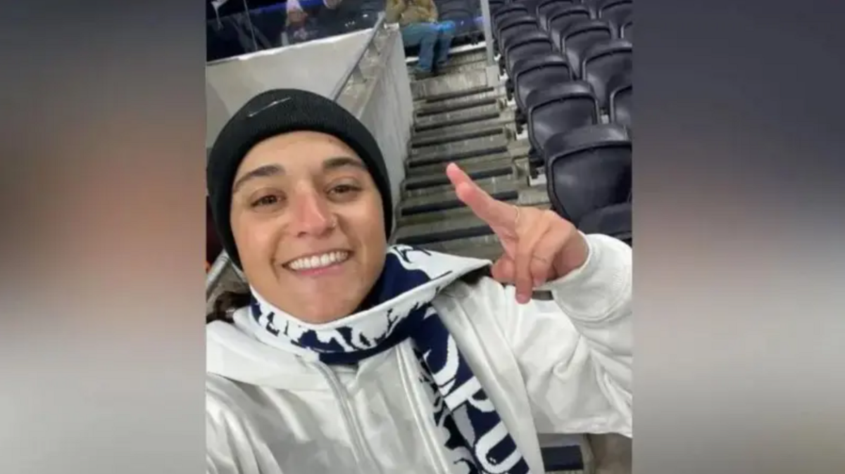 Emily Damari wearing a Tottenham Hotspur scarf at a game