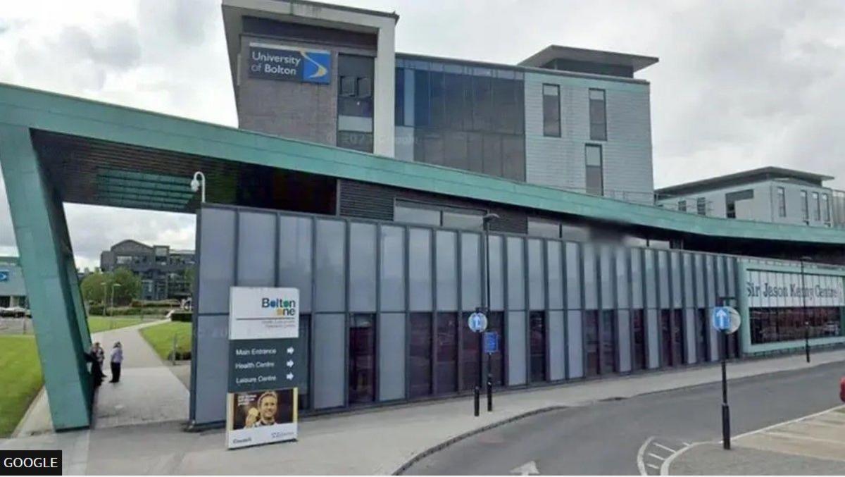 The green and grey exterior of the Sir Jason Kenny Centre at what was then called the University of Bolton.