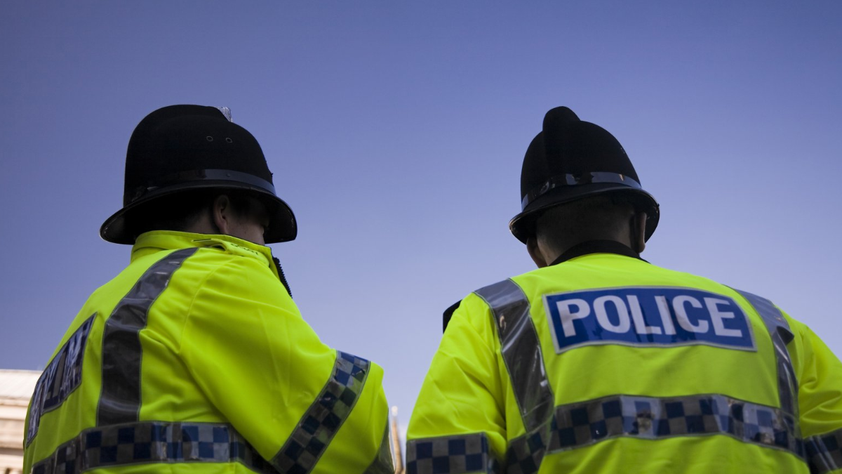 Two uniformed police officers. 