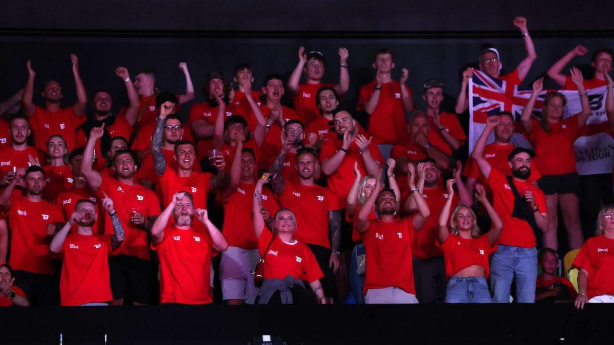 A group of Taylor Bevan's supporters cheer him on