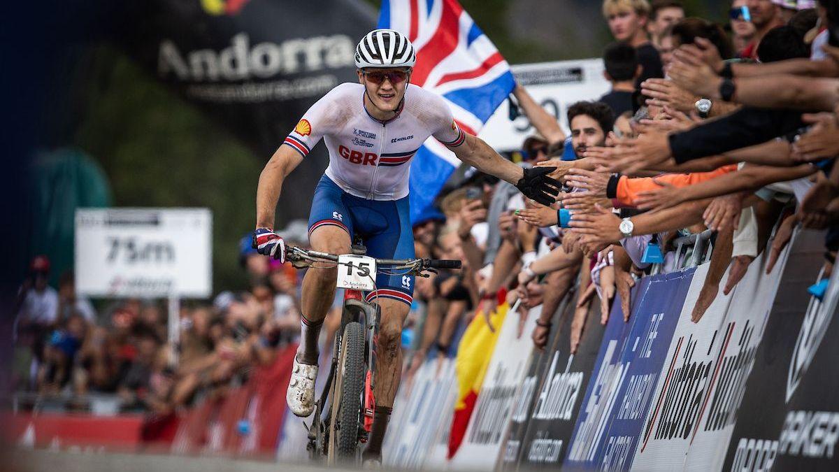 Charlie Aldridge "high fives" the crowd while competing for GB