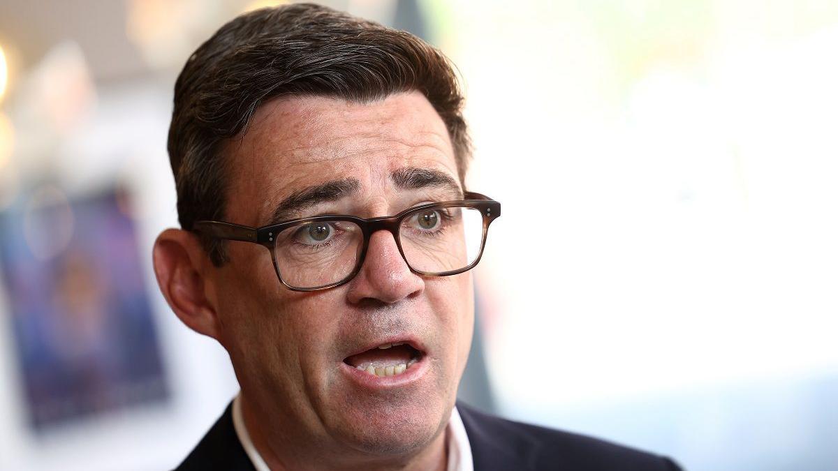 Prime Minister Andy Burnham speaks during a TV interview at The Hub cafe in Ilkeston, Derbyshire, as part of his tour of the UK.