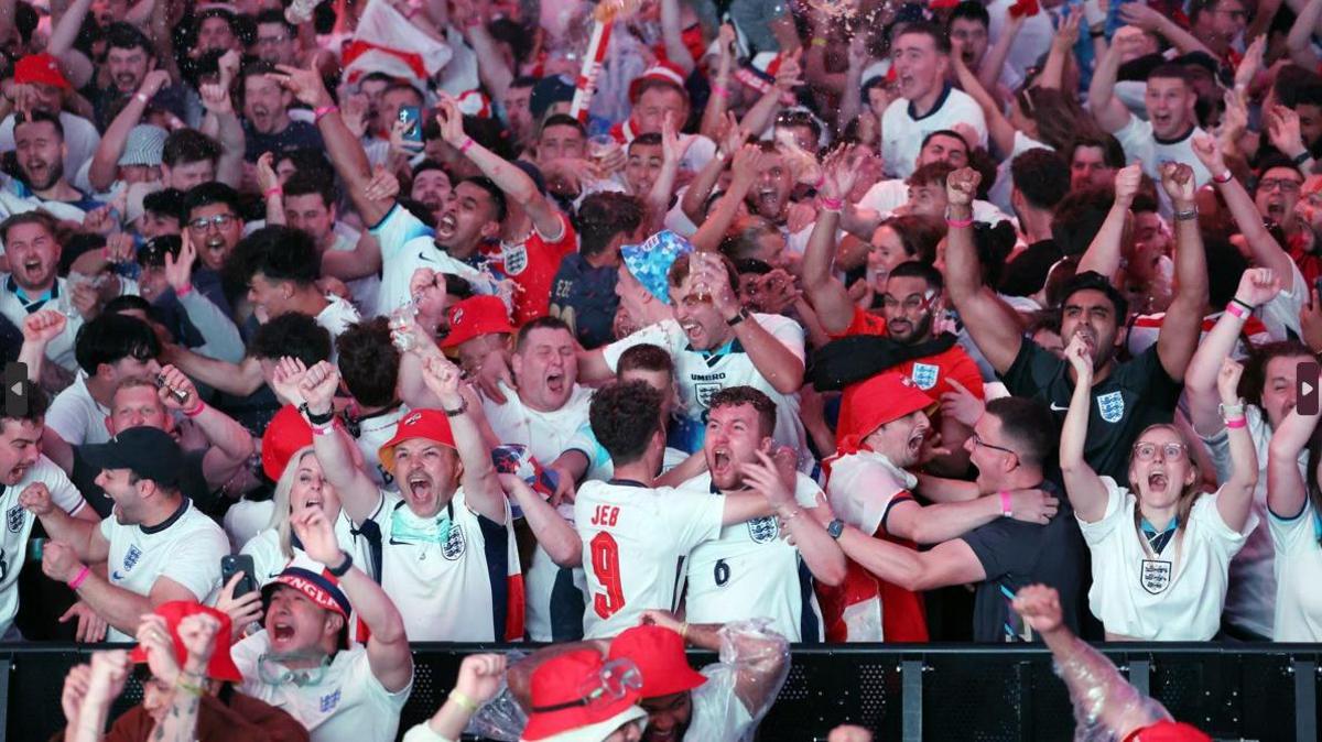 England fans celebrate Cole Palmer's goal