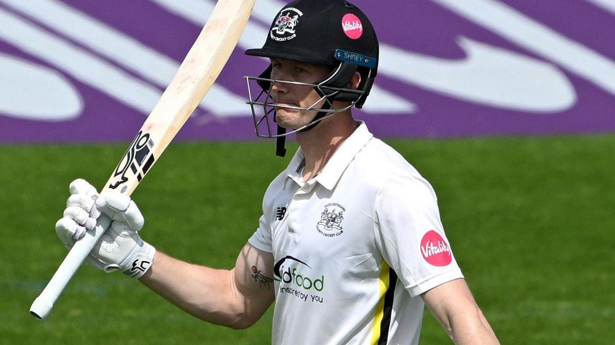 Cameron Bancroft raises his bat