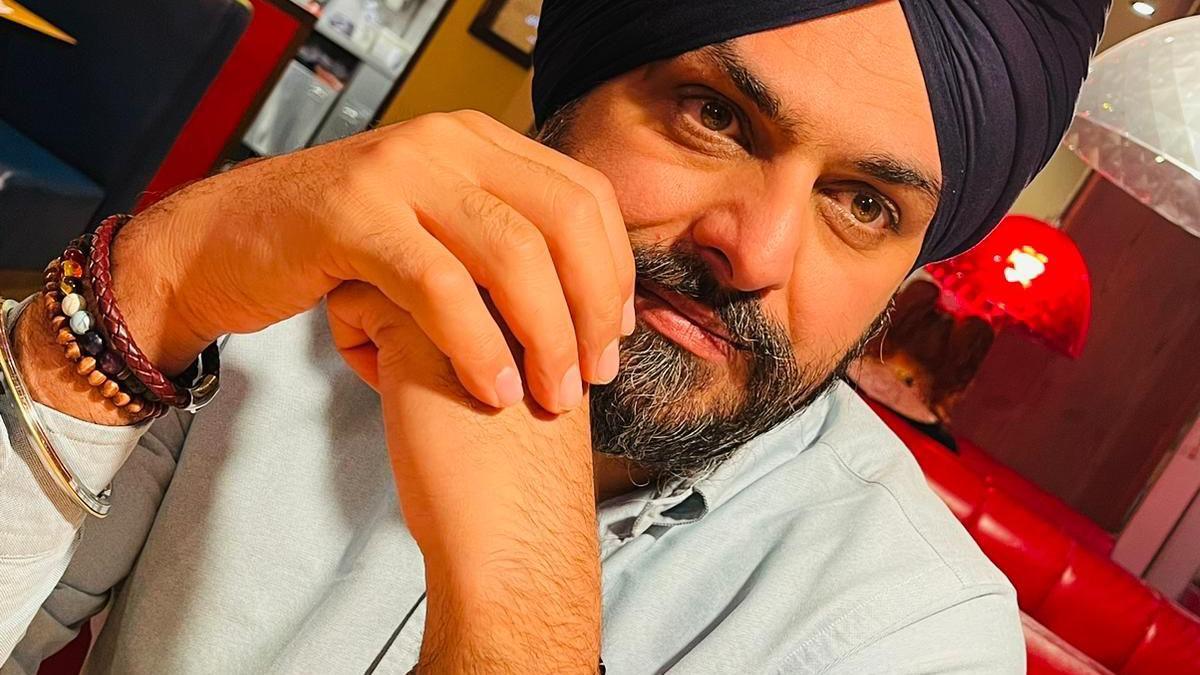 Bhupinder Sandhu wearing a light blue shirt and a blue turban.