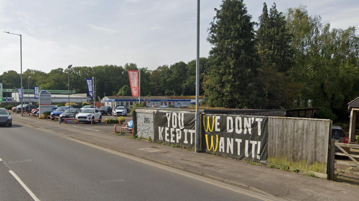 There had been opposition from some Sprowston residents to plans for a McDonald's in Mousehold Lane, as pictured by this neighbour's sign stating "you keep it, we don't want it" using the company's logo.