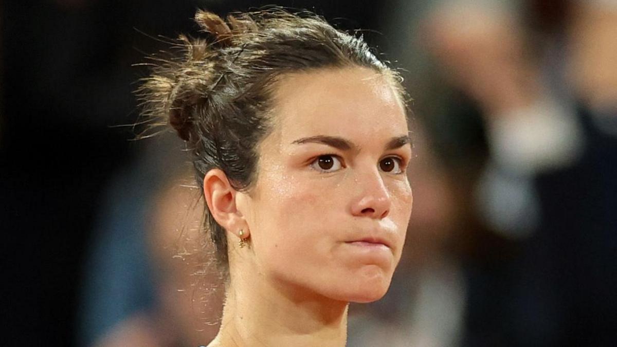France's Lois Boisson reacts after a point at the French Open