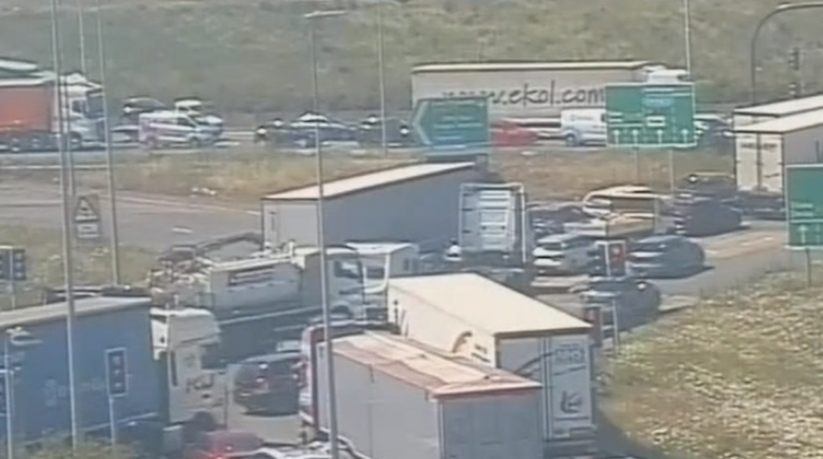 Lorries and cars stuck in a jam on a road