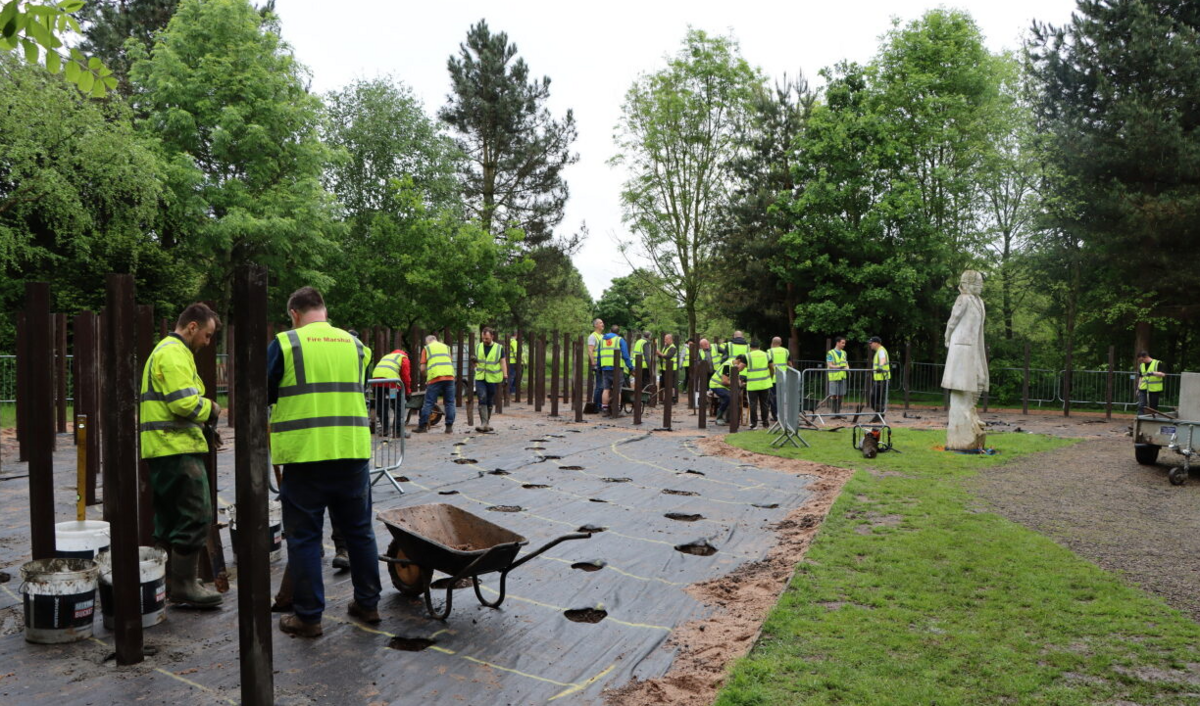 The memorial's stakes being replaced