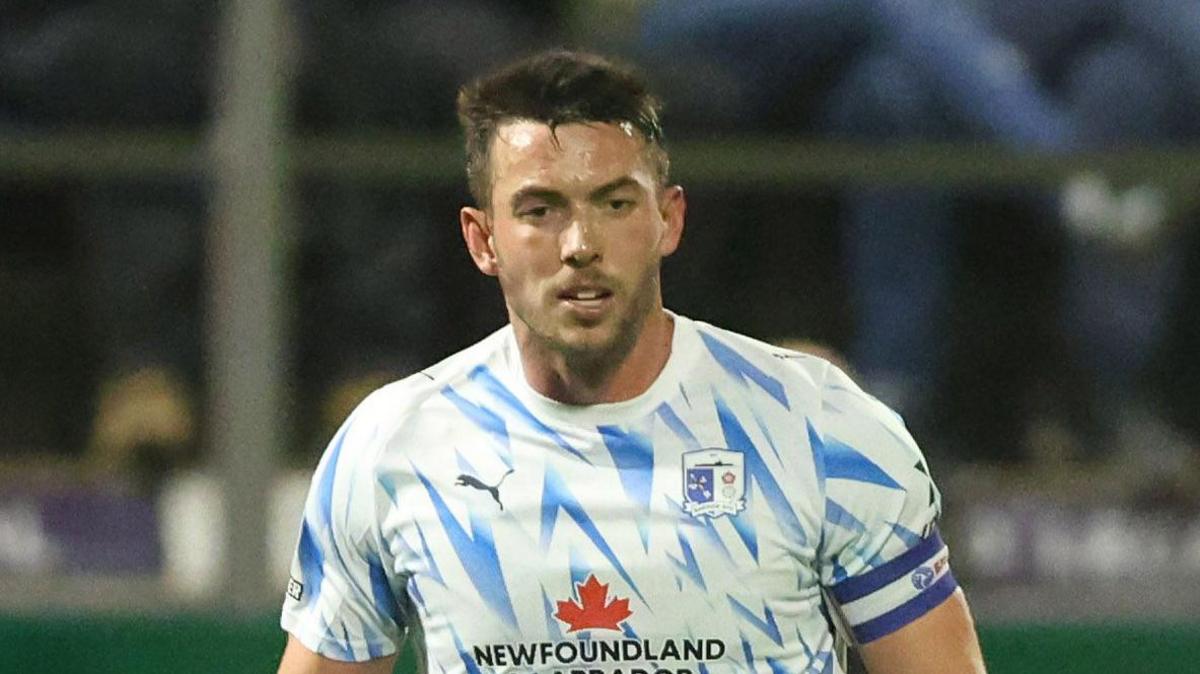 Niall Canavan playing for Barrow on a wet night at Holker Street