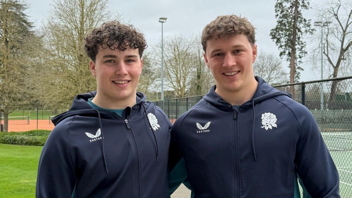 Declan Treacey (left) stands with his arm around brother Connor (right)