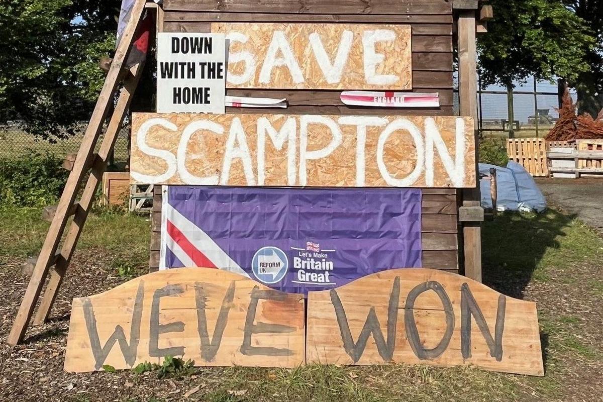 A tower built by campaigners states "Scampton" and "We've Won" 