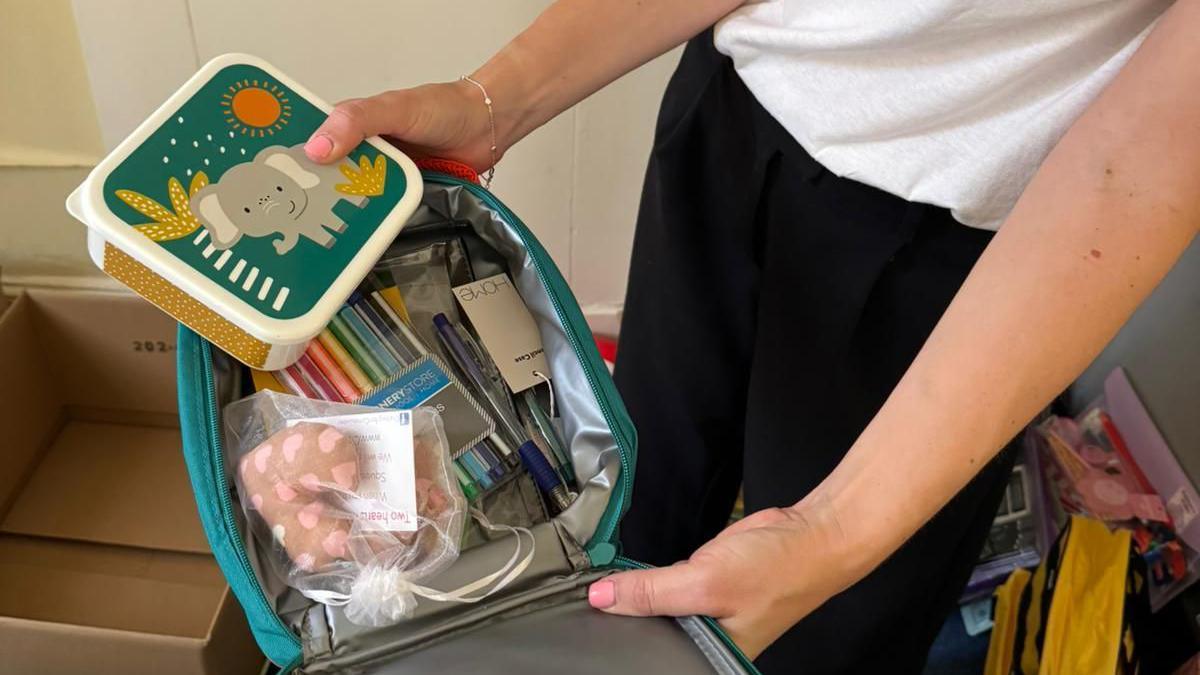 Pens and other stationery fill a large pencil case.