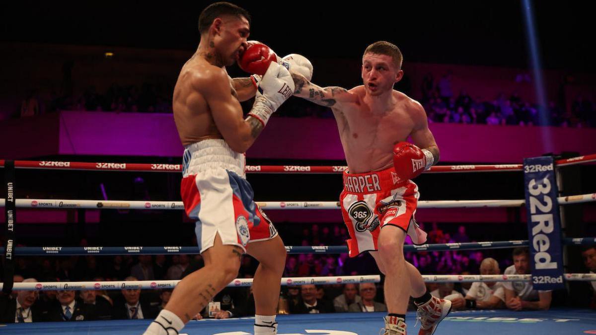 Ryan Garner throws a punch at Salvador Jimenez