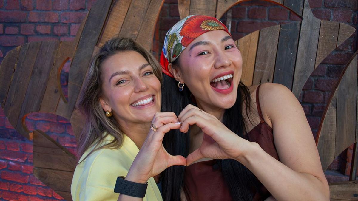 Jowita and Nancy making a heart with their hands in the Blue Peter studio.