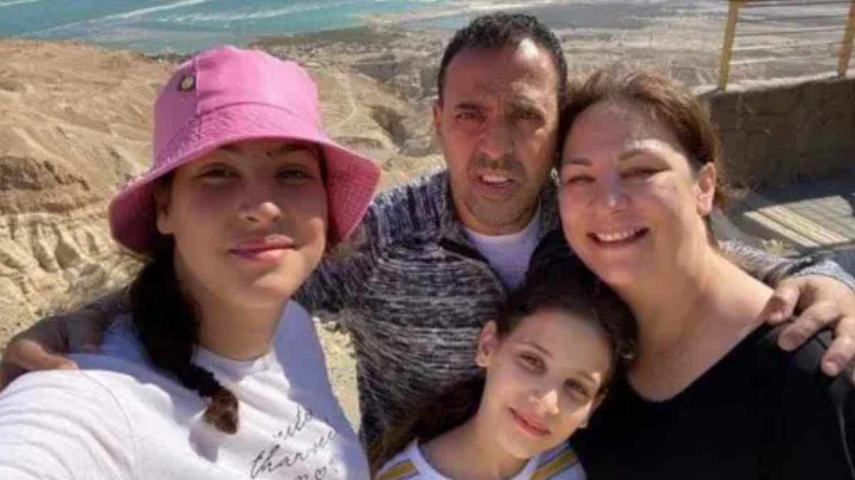 Eli Sharabi, pictured with his family, has been missing since he was captured 11 months ago