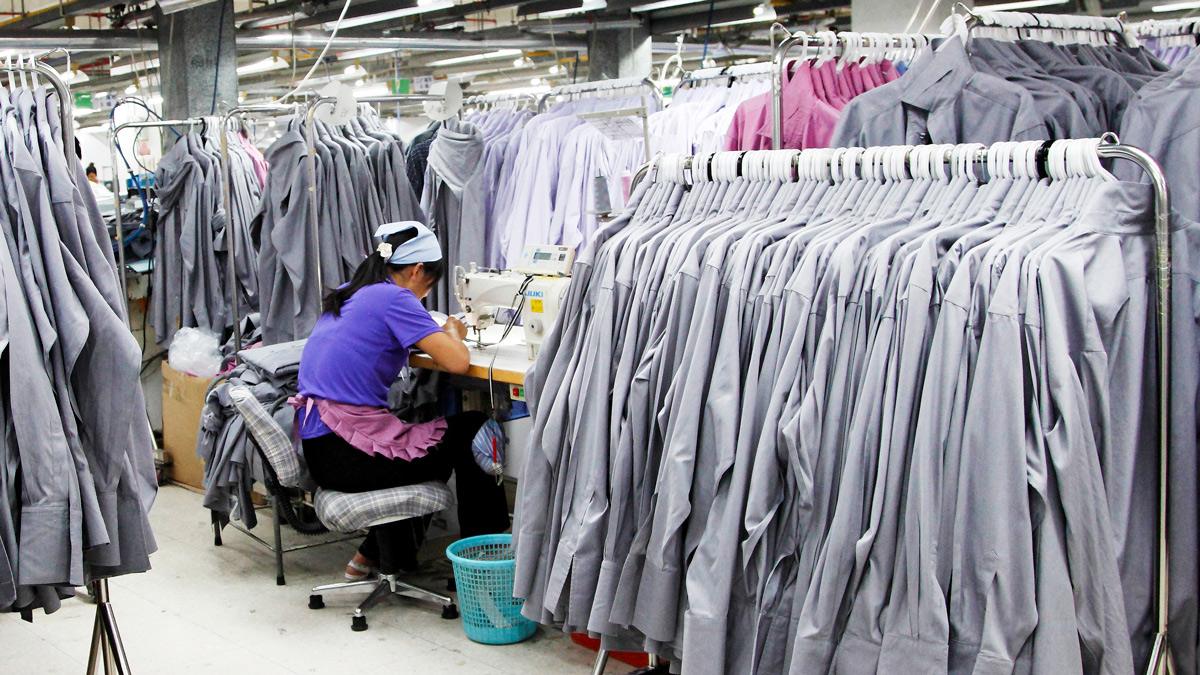 Textile worker in shirt factory