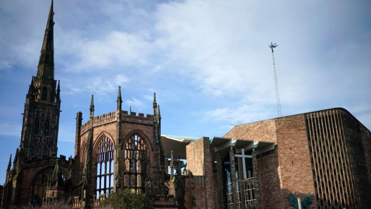 The remains of the bombed-out original Coventry Cathedral next to its modern replacement on the right