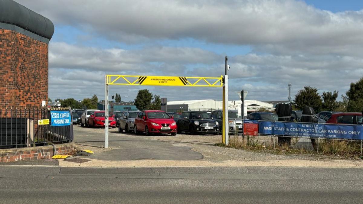 The car park to the side of HMP Lincoln with "Strictly NHS staff and contractor car parking only" signs