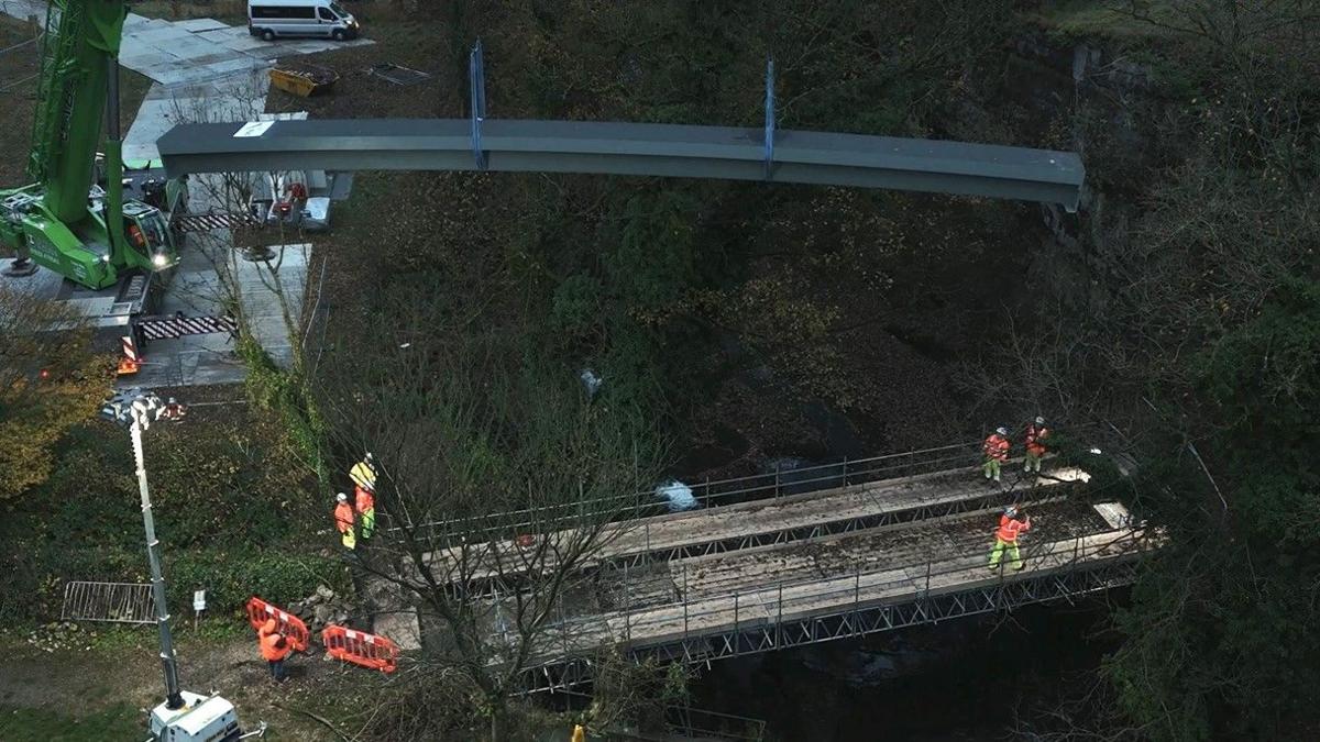A crane hoisting a large platform into place across theR&C Williams River Wye.
