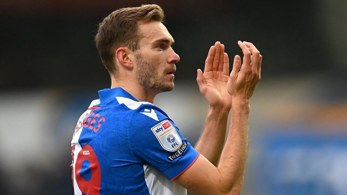 Blackburn Rovers winger Ryan Hedges applauding fans