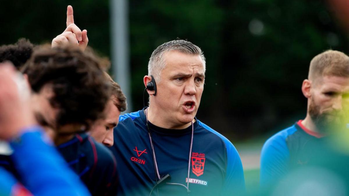Andy Last holds his finger up in the air as he addresses his players in training