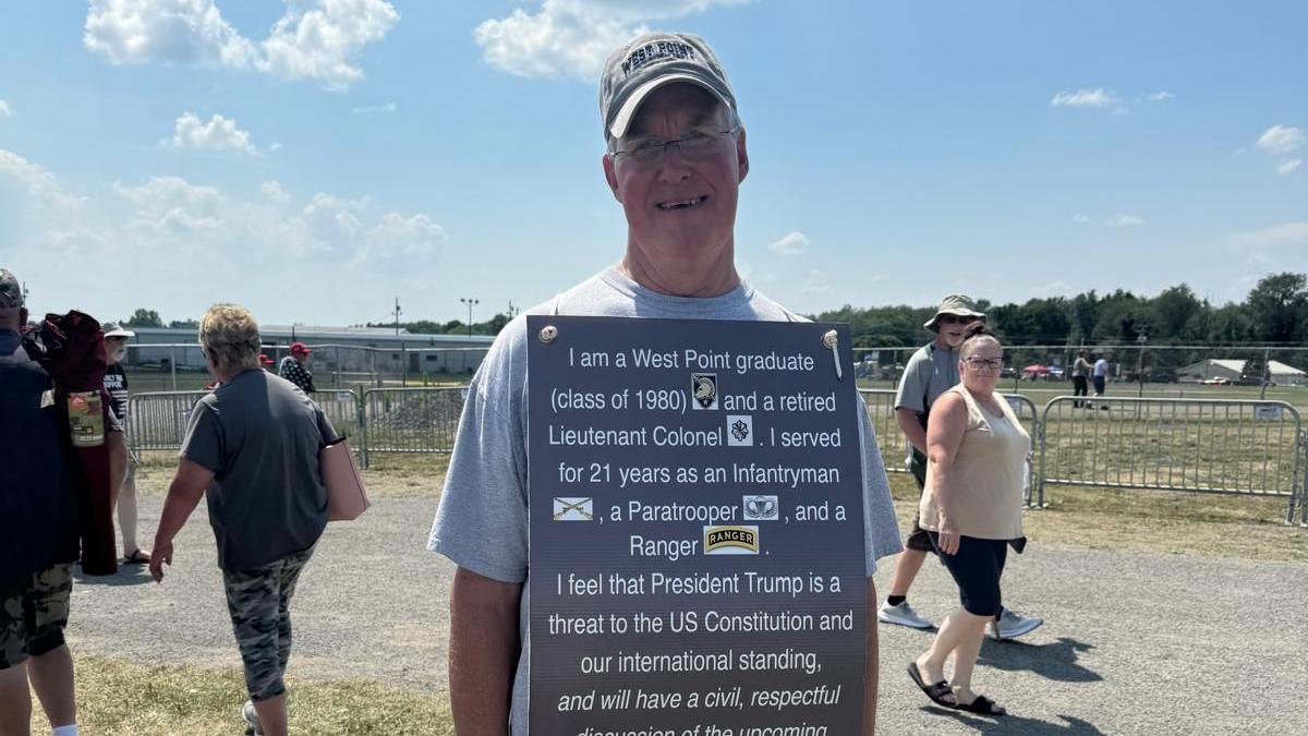 Thomas Gleason with a placard