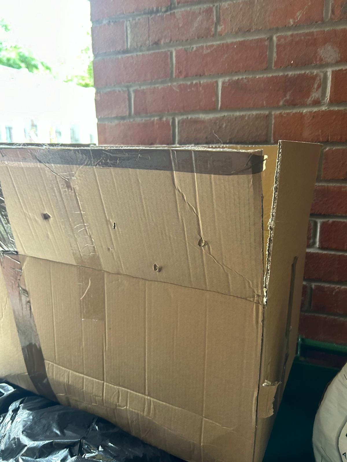 A cardboard box with holes in it