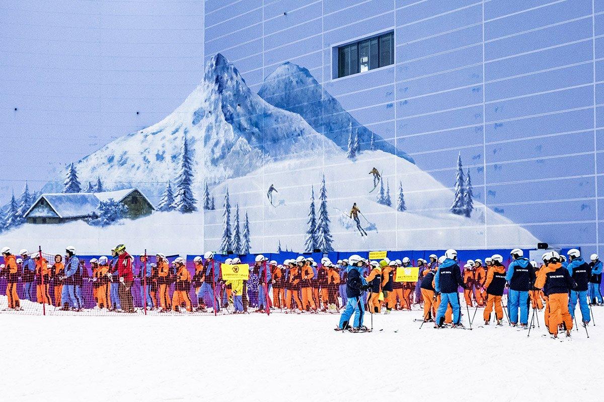 Skiers queuing to get on the slope