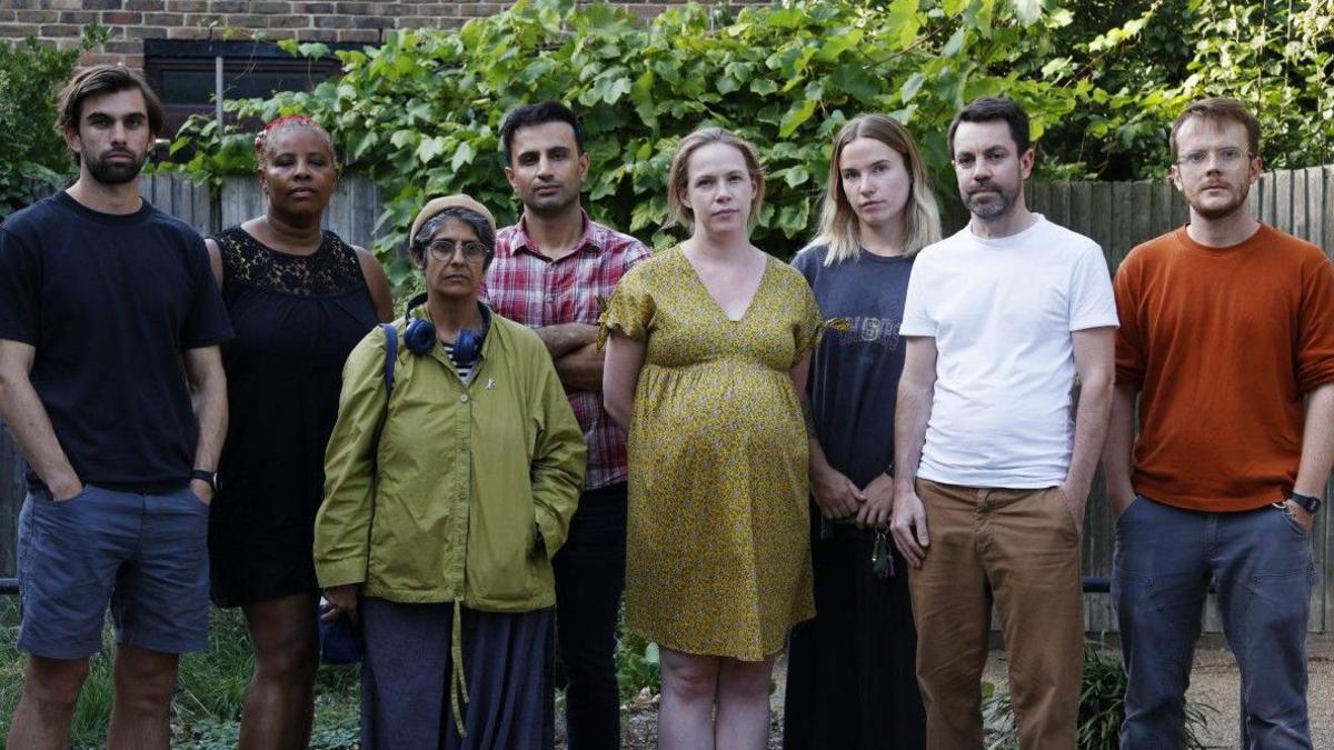 A group of eight affected residents lined up for a picture.