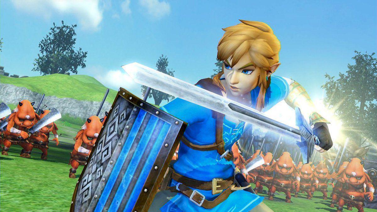 Link from Zelda, dressed in the blue tunic from Breath of the Wild, wields the Master Sword and a shield in front of scores of moblins - a short goblin-like creature.