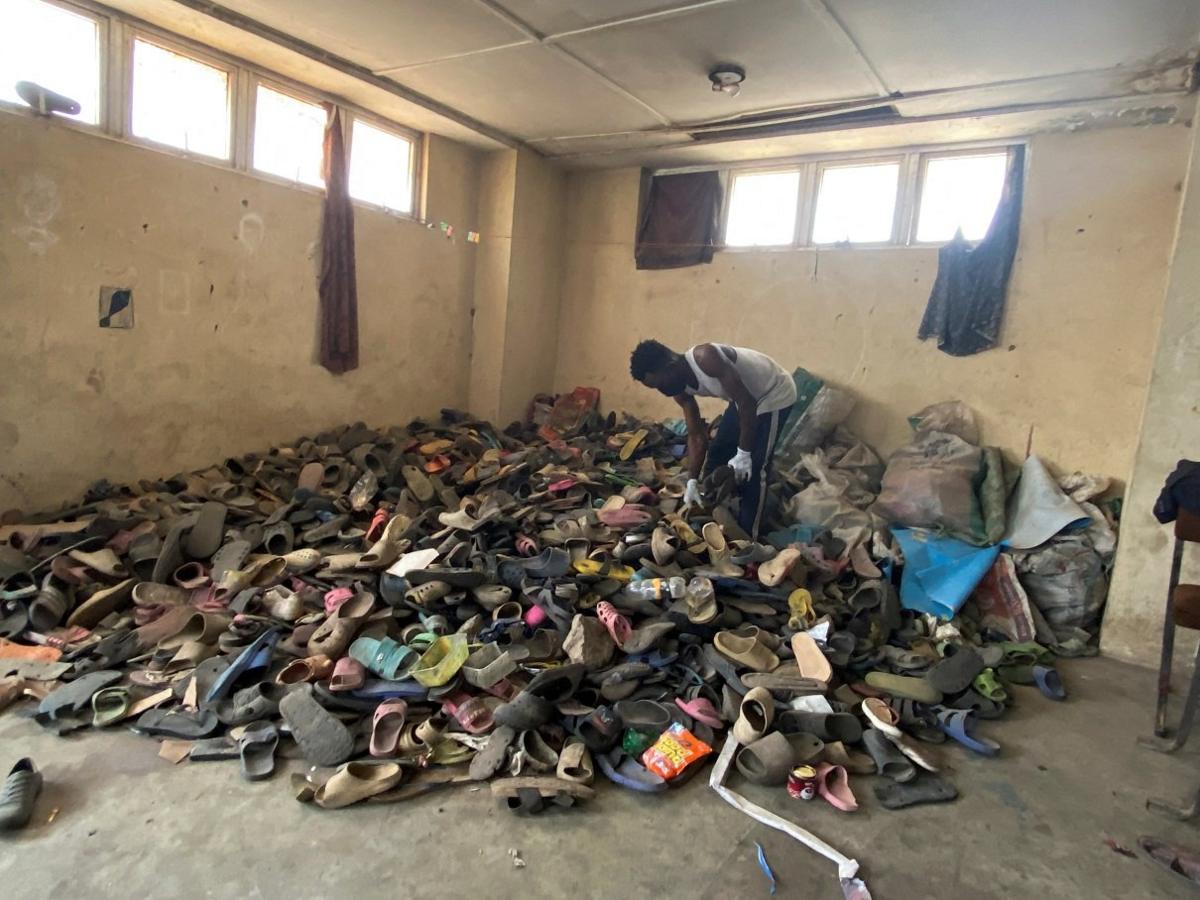 man-sorting-through-flipflop-sandals.